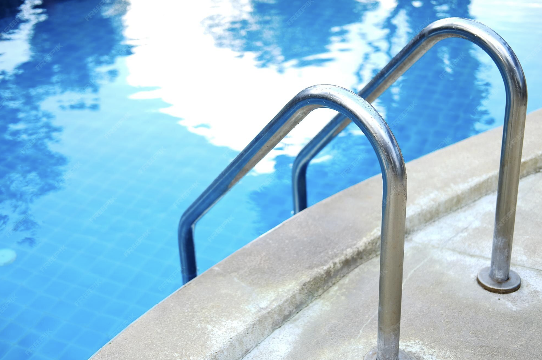 Swimming Pool, a spacious and relaxing area designed for leisure and enjoyment, featuring comfortable loungers and a calm atmosphere.